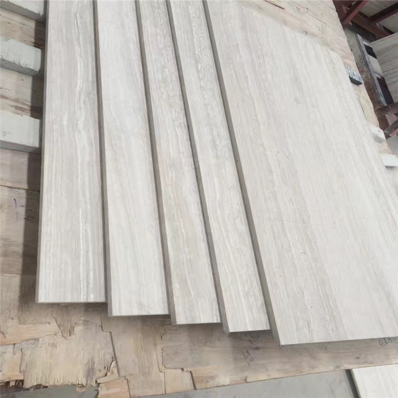  Promoción Venta de mármol de madera blanco chino 610x305x10mm azulejos pulidos